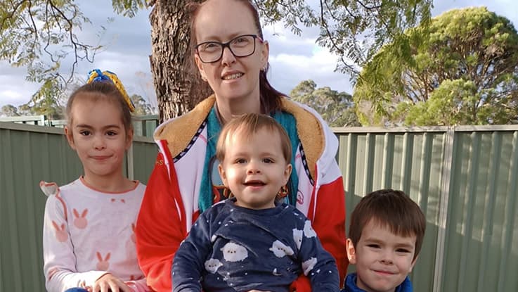 a mother with her three young children