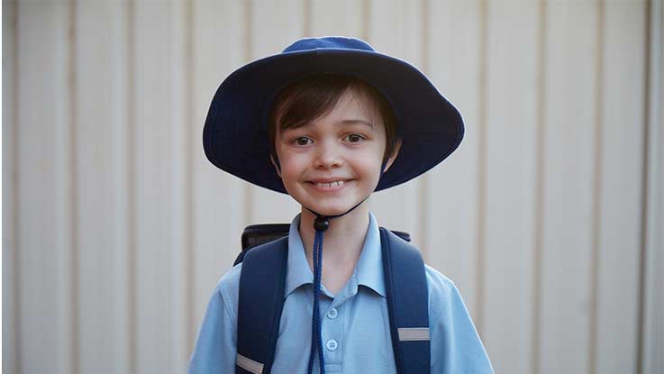 Blly looking happy in his school uniform