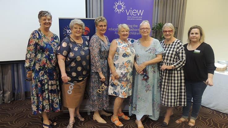 a group of ladies standing together