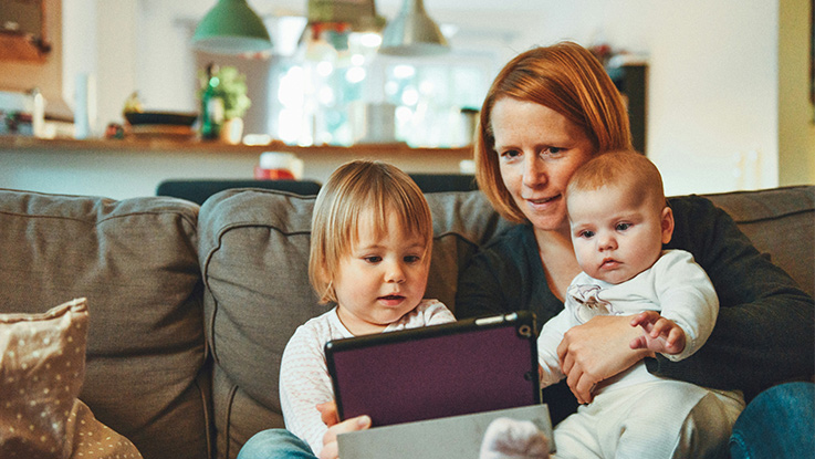 Mother and daughter looking at a phone