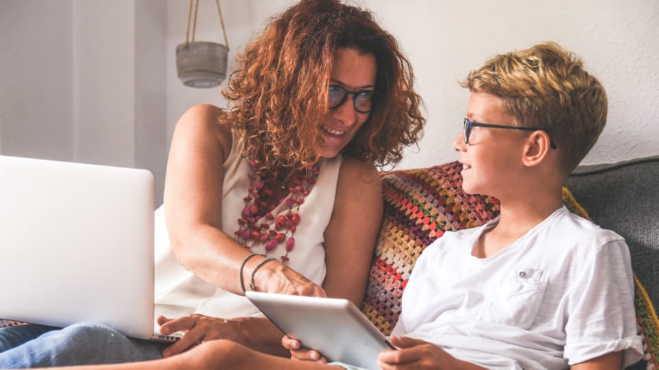 mother and son using technology