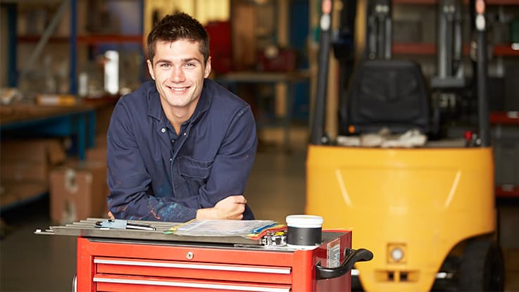 mechanic standing at toolbox