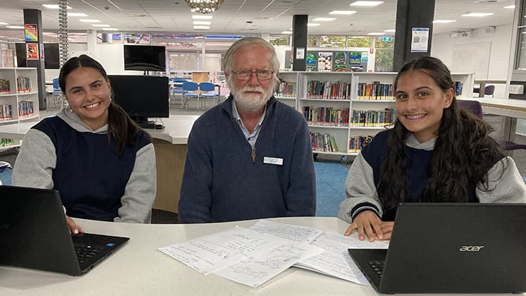 Jasmine, volunteer tutor Chris and Natalie at Learning Club