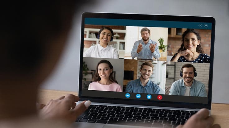 A person on zoom video call on his laptop