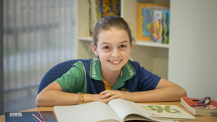 emerald-at-desk-with-book