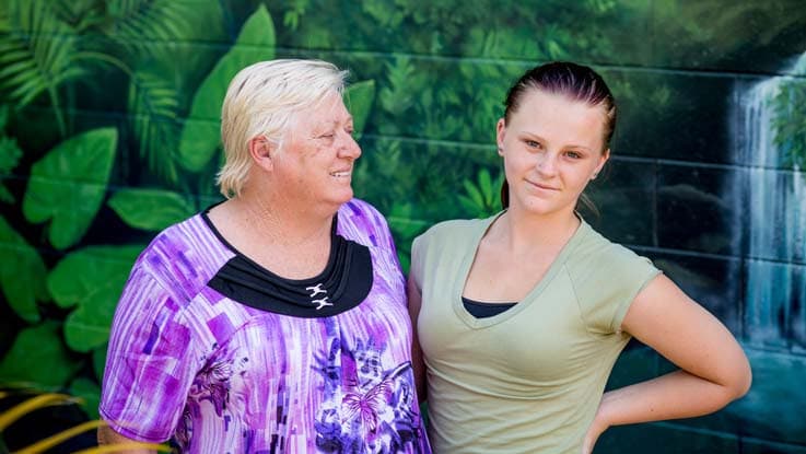 Crystal standing with her mum